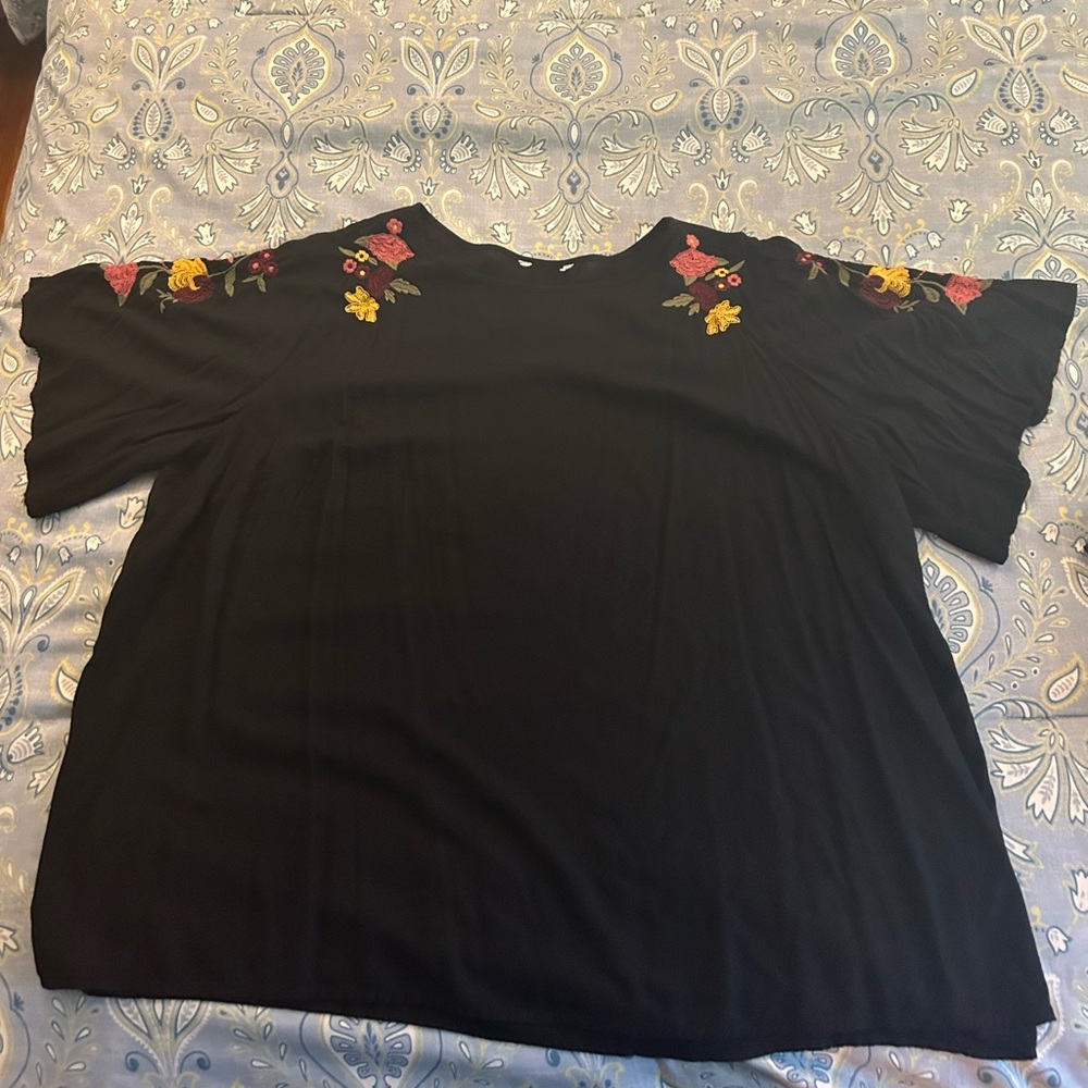 Black flutter sleeve top with embroidered shoulders